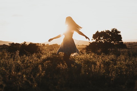 Image of girl dancing in a feild