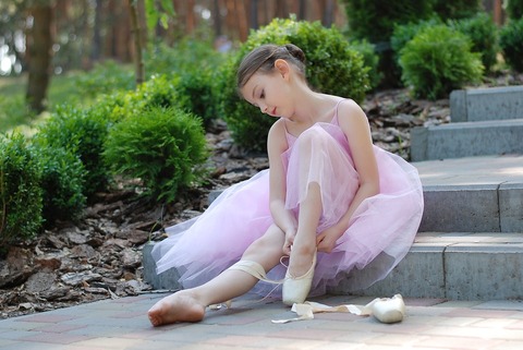 Image of girl putting on dancing