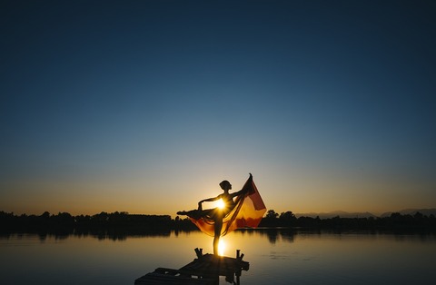 Image of girl dancing on the beach